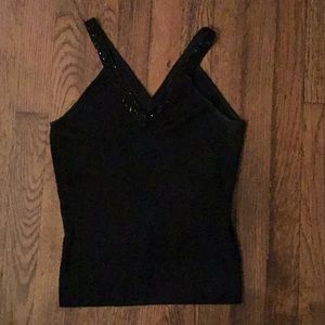 Black sleeveless sweater with beaded neckline